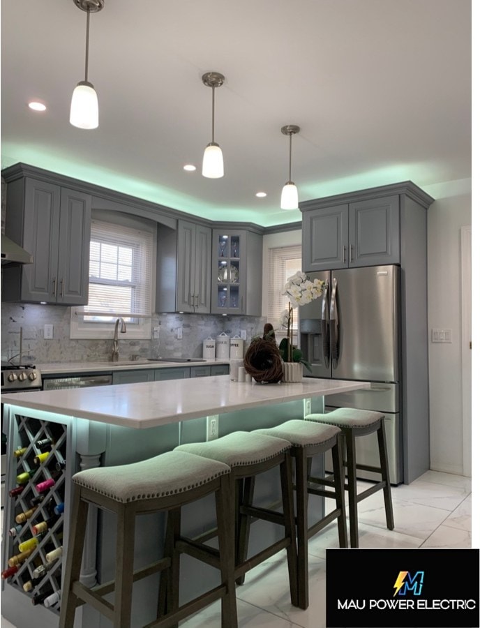 Modern kitchen lighting refresh by Maupower Electric Inc — pendant fixtures, recessed cans, and LED cove lighting